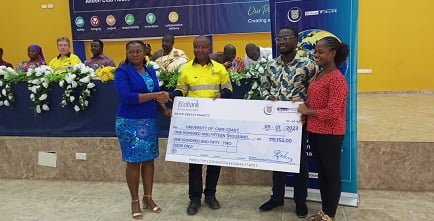 GFGF-1-Robert-Siaw-middle-presenting-a-dummy-cheque-to-Ms-Esther-Dede-Azzu-left.jpg