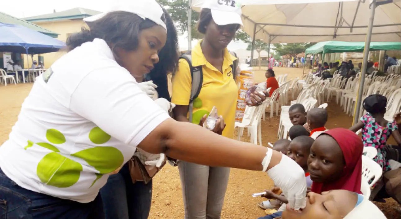 Health-personnel-deworm-children-during-Throne-Room-Parishs-outreach-at-Kuduru-Bwari-on-Saturday.jpg