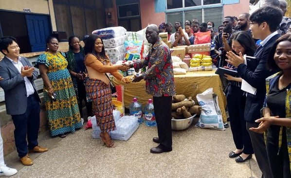 KOICA-DONATION-1-MrsLoviaAfoakwa-presenting-the-items-to-the-Chairman-for-the-Orphanage-Rev.-Joe-Ocran.jpg
