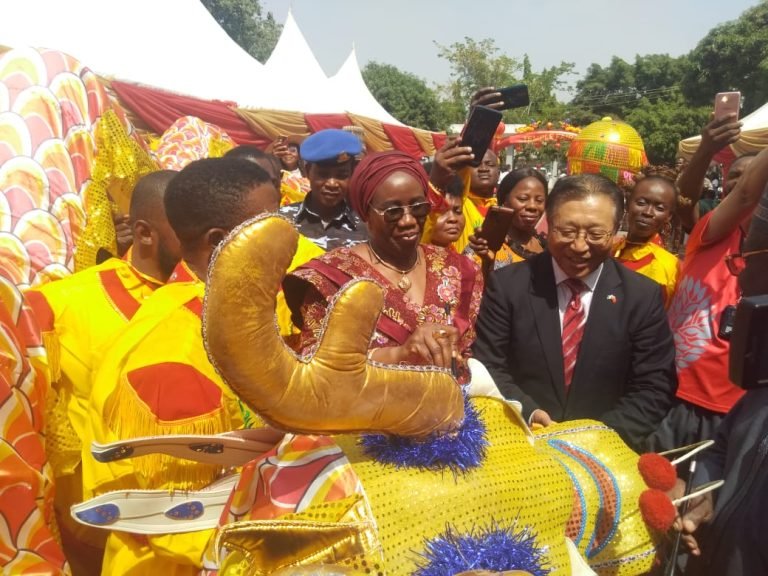 Permanent-Secretary-Ministry-of-Information-and-Cultures-Mrs-Lydia-S.-Jafiya-joined-by-the-Chinese-Ambassador-to-Nigeria-Ambassador-Cui-Jianchun-writes-on-the-Dragons-head.jpg