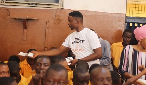 GTA-Chocolate-Mr-Quaye-sharing-some-of-the-chocolate-to-the-pupils.jpg