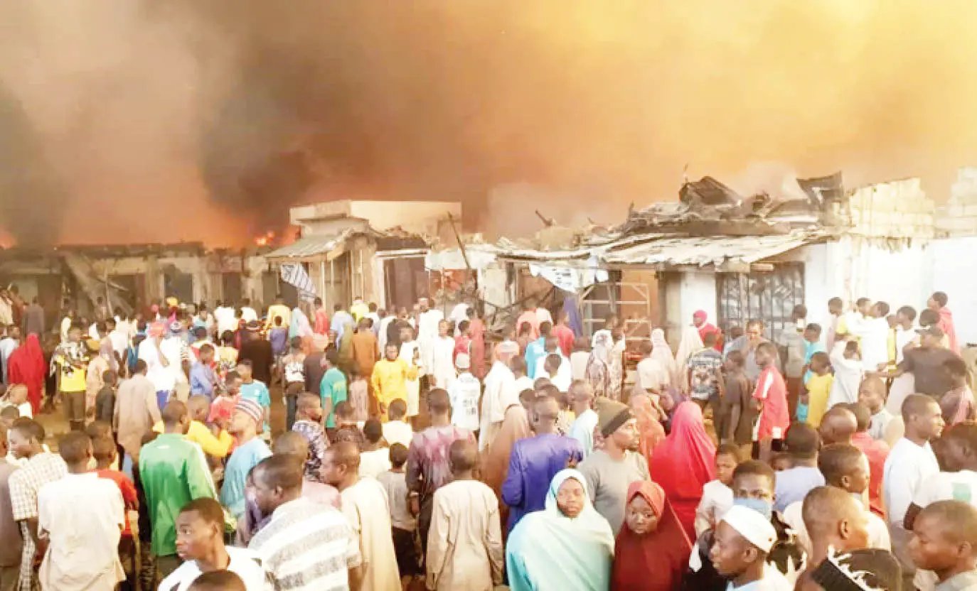 Traders-and-sympathisers-watch-as-fire-consume-shops-at-the-market.jpg