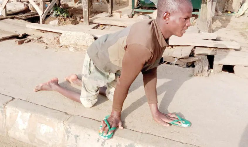 Abubakar-Musa-a-21-year-old-victim-of-polio-in-Jos.jpg