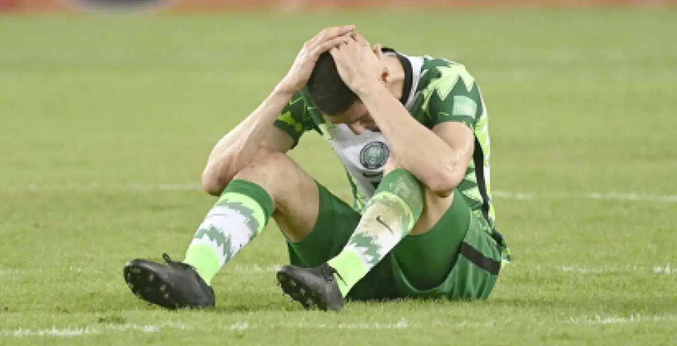 Super-Eagles-defender-Leon-Balogun-sits-dejected-on-the-pitch-after-the-2022-World-Cup-failure.jpg