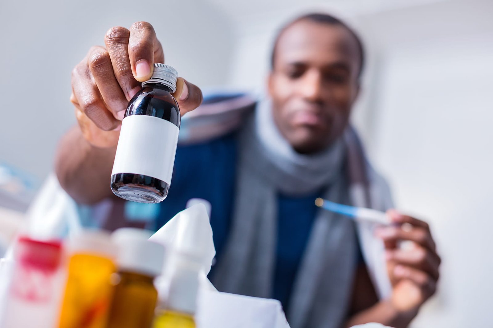 selective-focus-medicine-being-taken-by-nice-pleasant-adult-man-while-having-cold.jpg