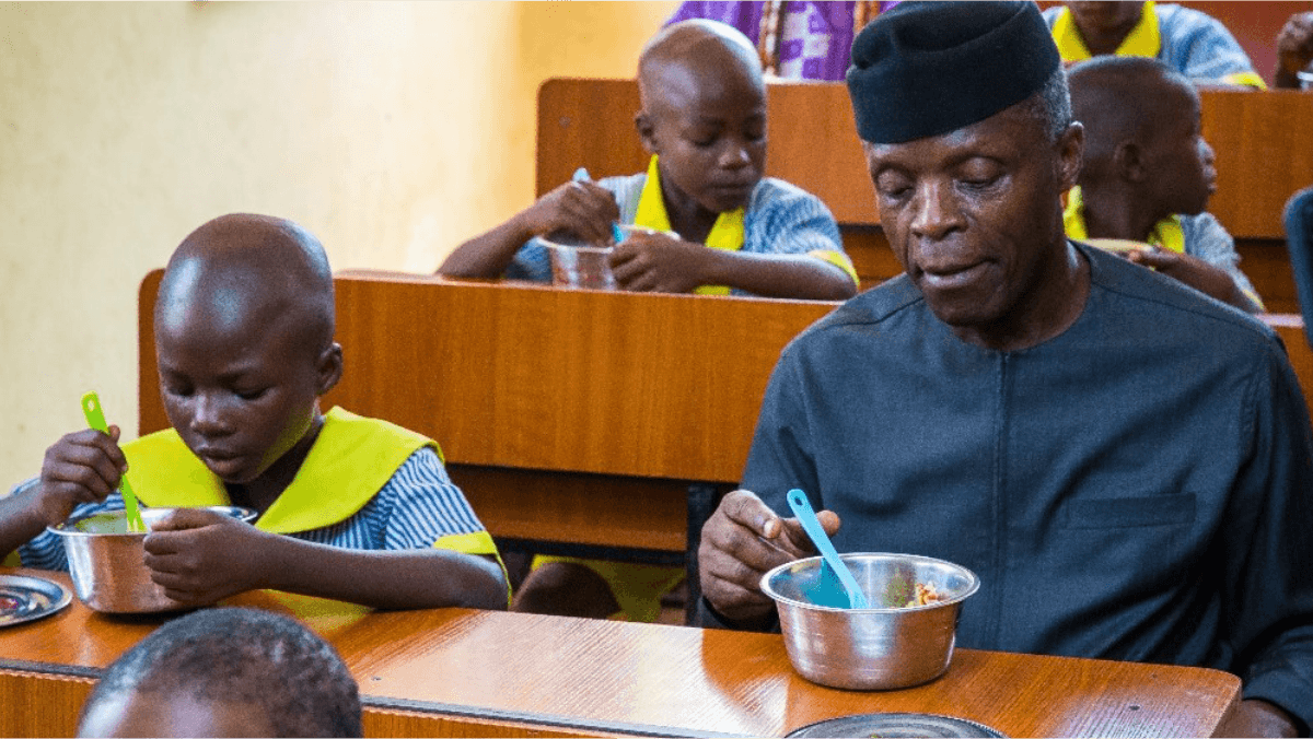 SCHOOLCHILDREN-EATING-IN-CLASSROOM-WITH-OSINBAJO.png