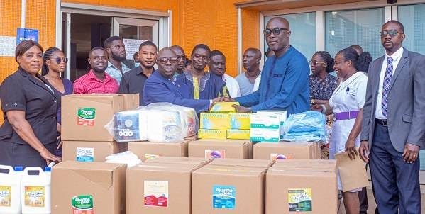 donation-pix-Prof.-Ansong-left-presenting-some-of-the-items-to-Prof-Okyere-Addai-right-Mensah-CEO-of-KATH-left-.jpg