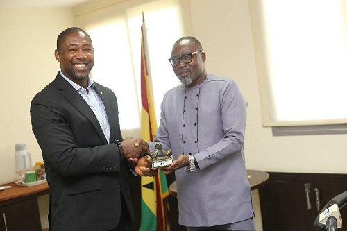 Mr-Osei-Asibey-right-presenting-a-miniature-trophy-to-Dr-Okoe-Boye.jpg