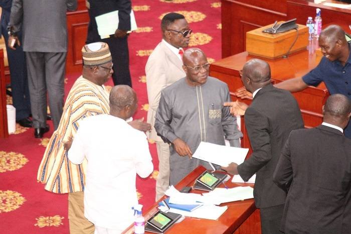 SPILLLAGE-Mr-Ken-Ofori-Atta-back-facing-cameraMr-Osei-Kyei-Mensah-Bonsu-middle-Dr-Cassiel-A.-Forson-right-interacting-after-the-budget-presentation.Photo_.-Ebo-Gorman.jpg